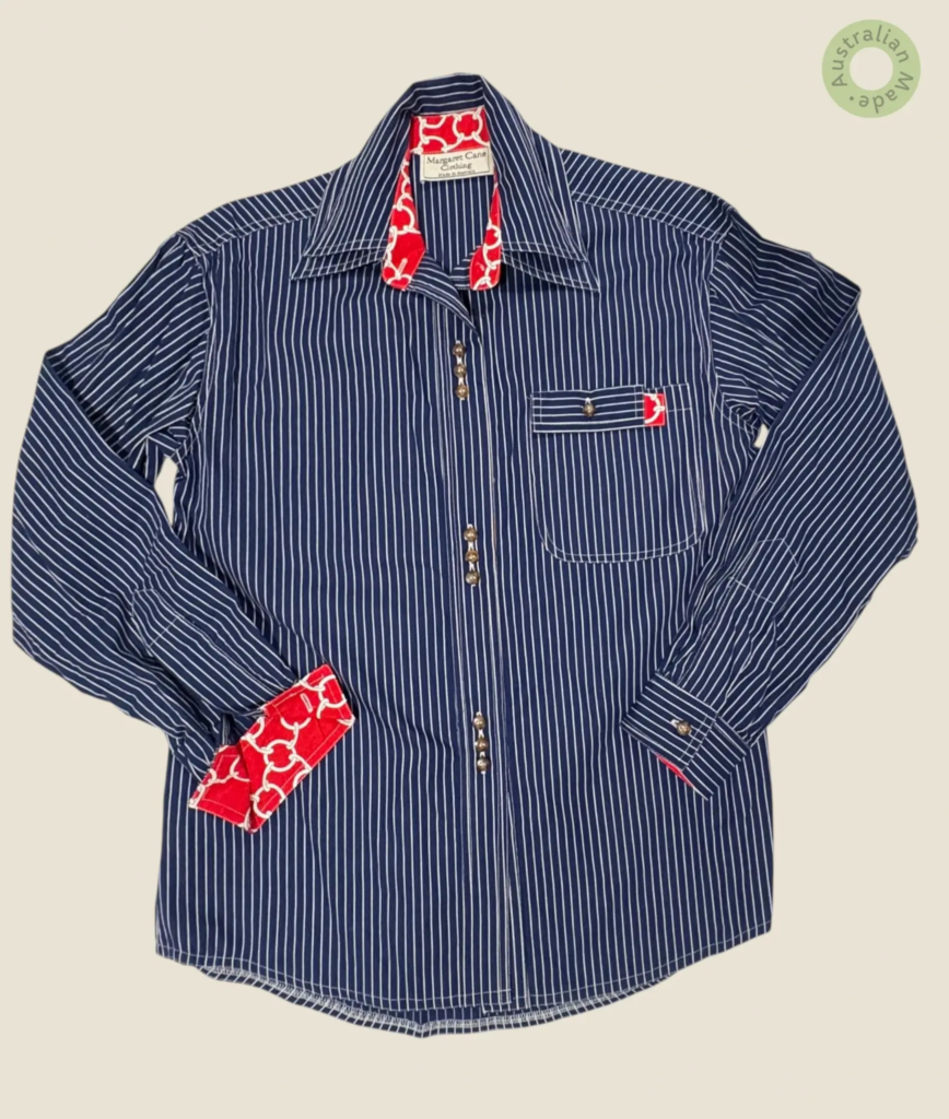 #104 – Navy cotton shirt with fine white vertical stripes, featuring bold red contrast