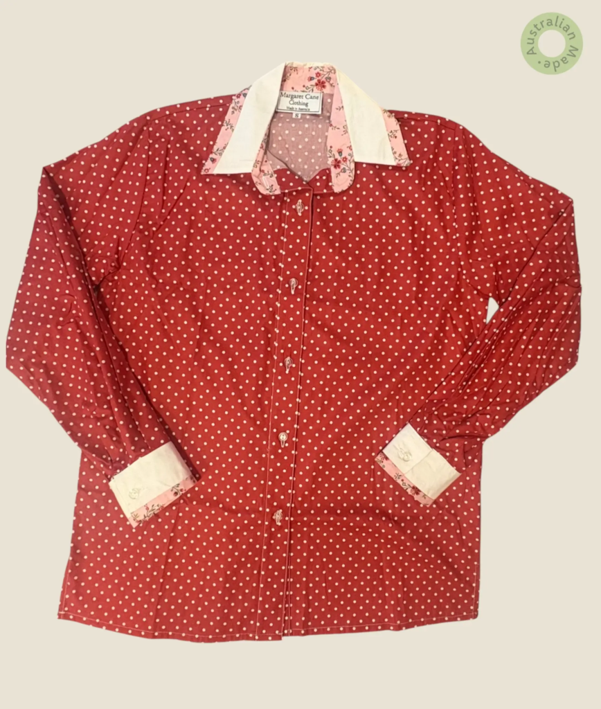 #203 – Terraacota Red with small white polka dots, White for cuffs and collar. Soft pin