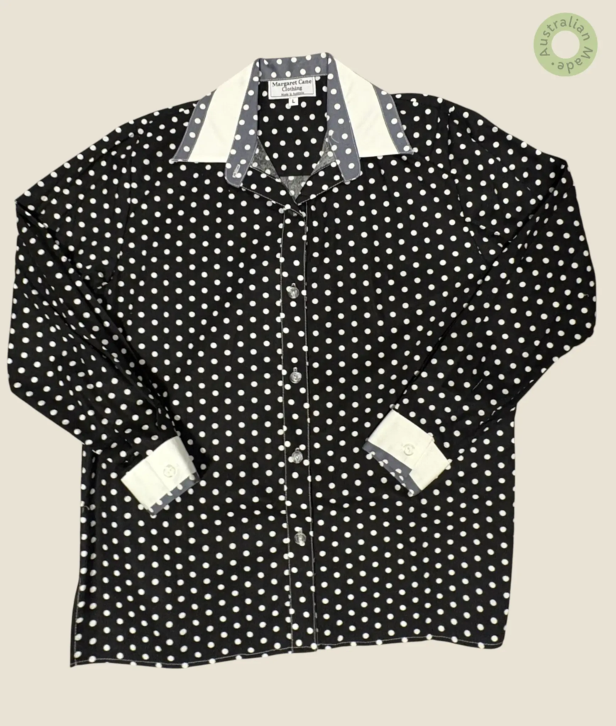 #205 – Black base shirt with all-over small white polka dot print, complemented by cris