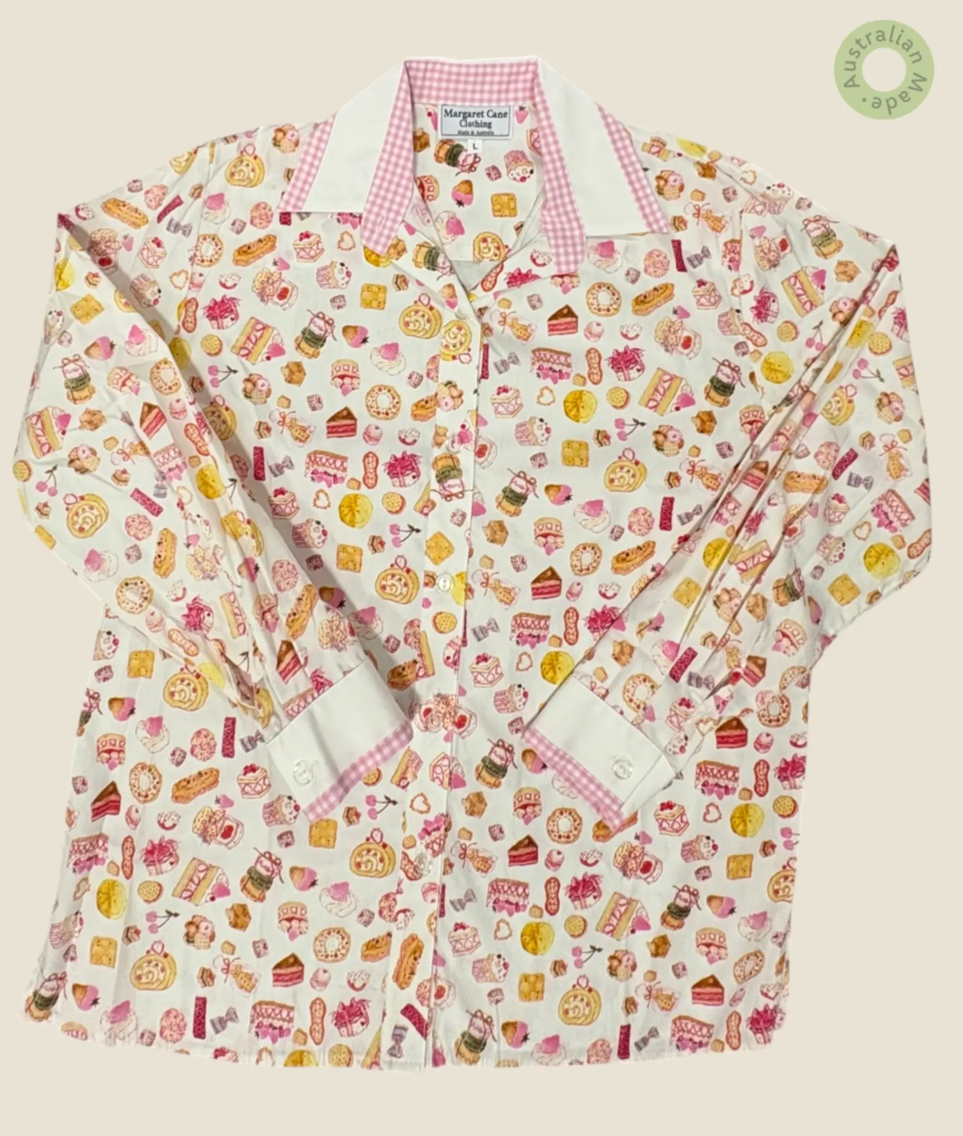 #207 – White base shirt with an all-over multi-coloured illustrated sweets and pastry p