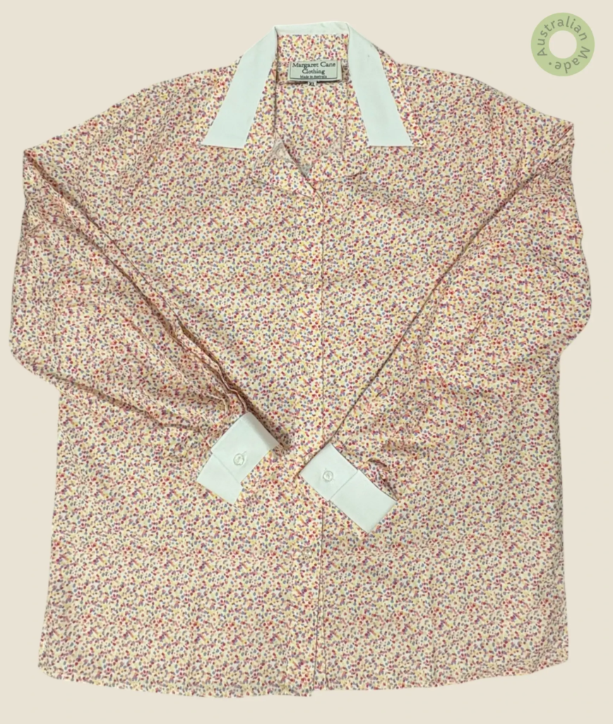 #209 – Cream base shirt featuring an all-over ditsy floral print in shades of pink, pur