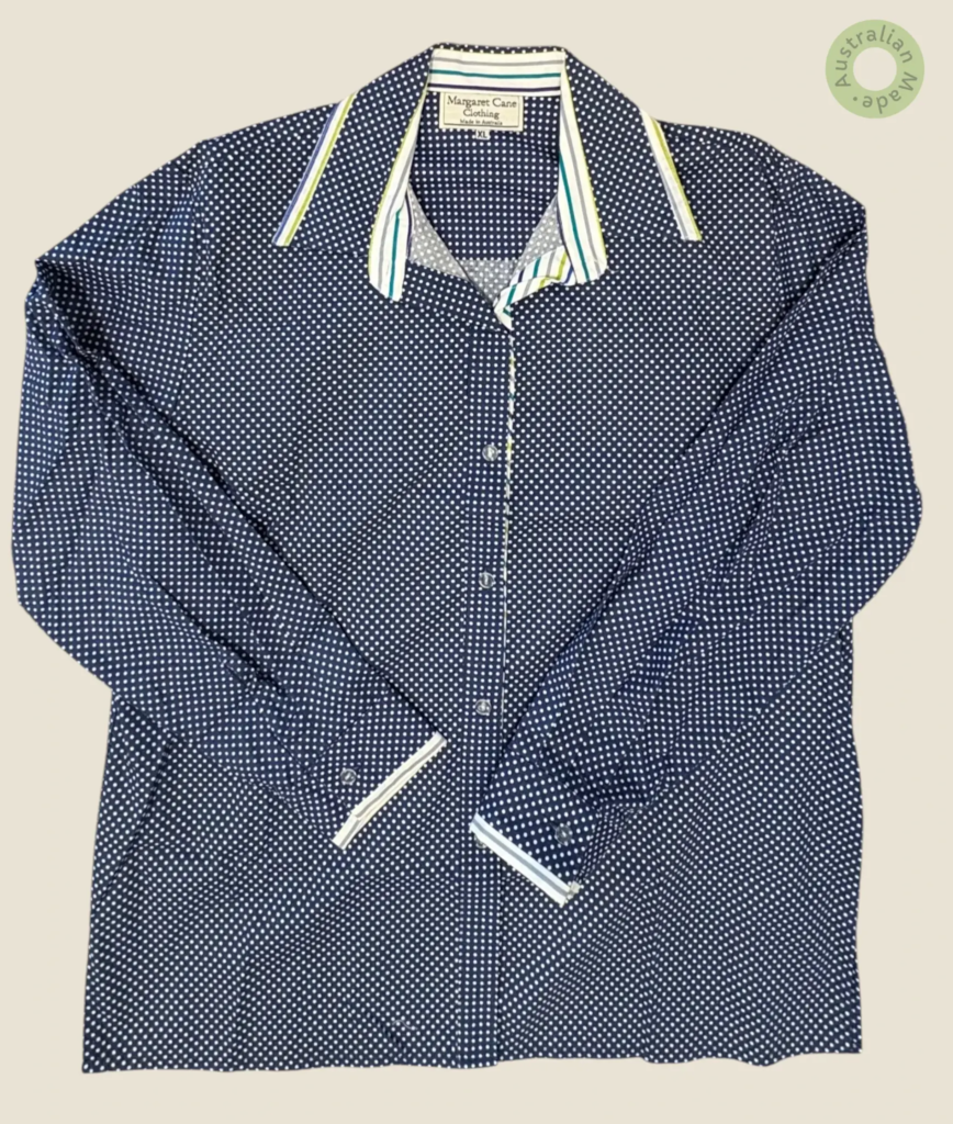 #217 – Navv blue base shirt with an all-over white polka dot print. Complemented by a c