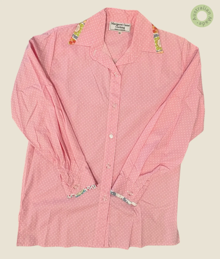 #218 – Candy pink base shirt featuring an all-over white micro-dot print. The design is