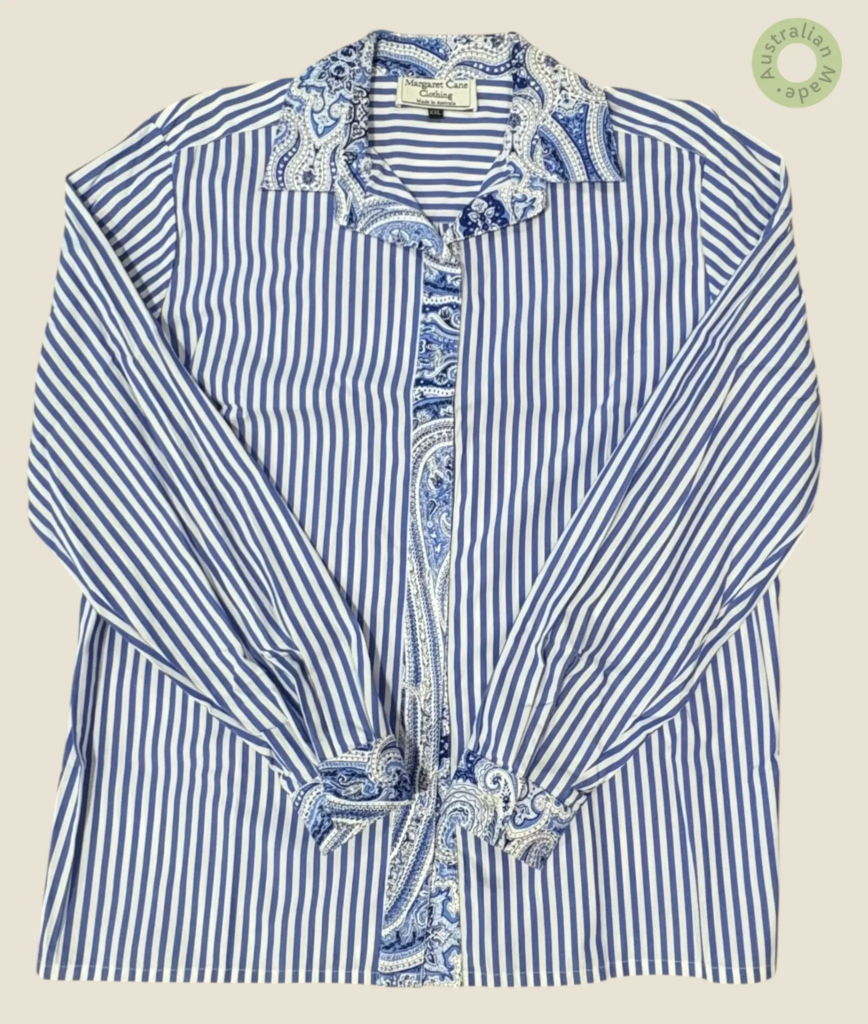 #403 – A crisp blue and white vertical stripes. This classic pattern is elevated by a d