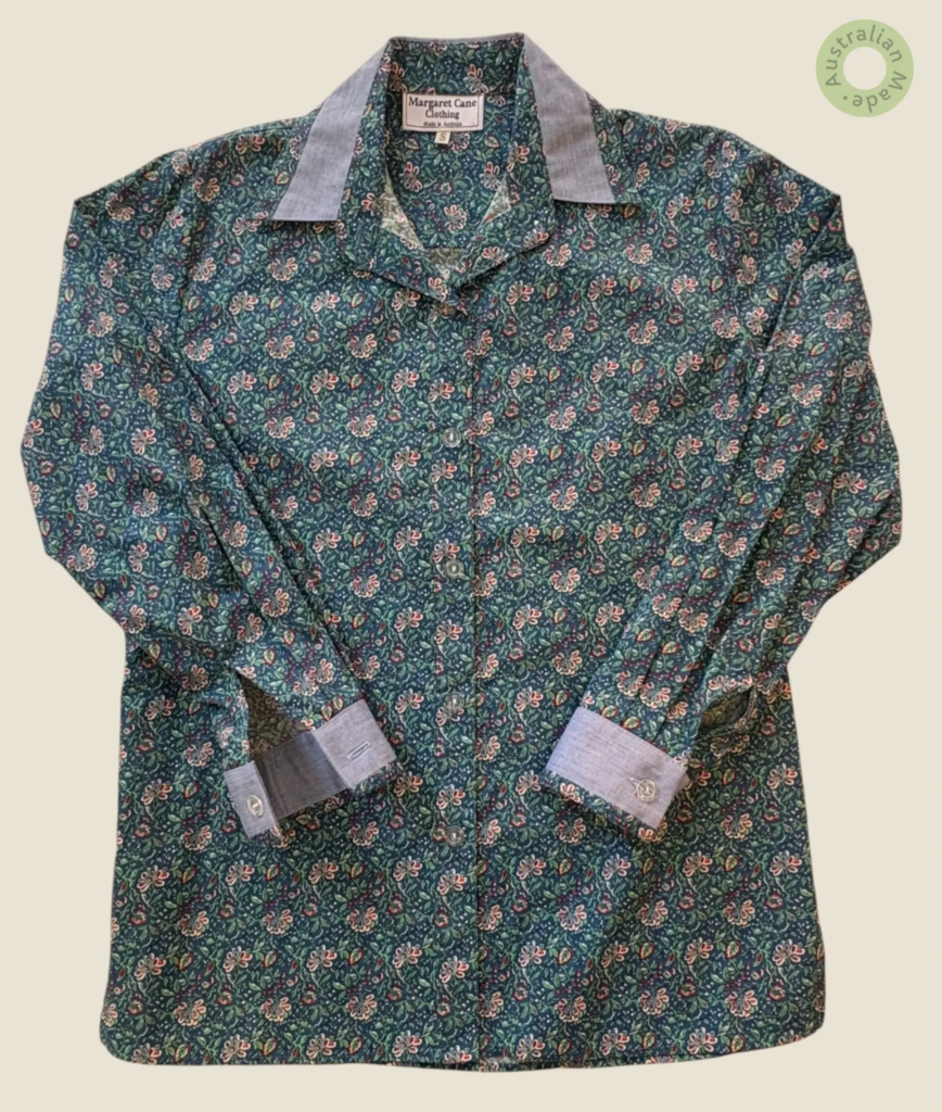 #222 – A dense, vintage-inspired botanical print on a deep teal-green base. The pattern