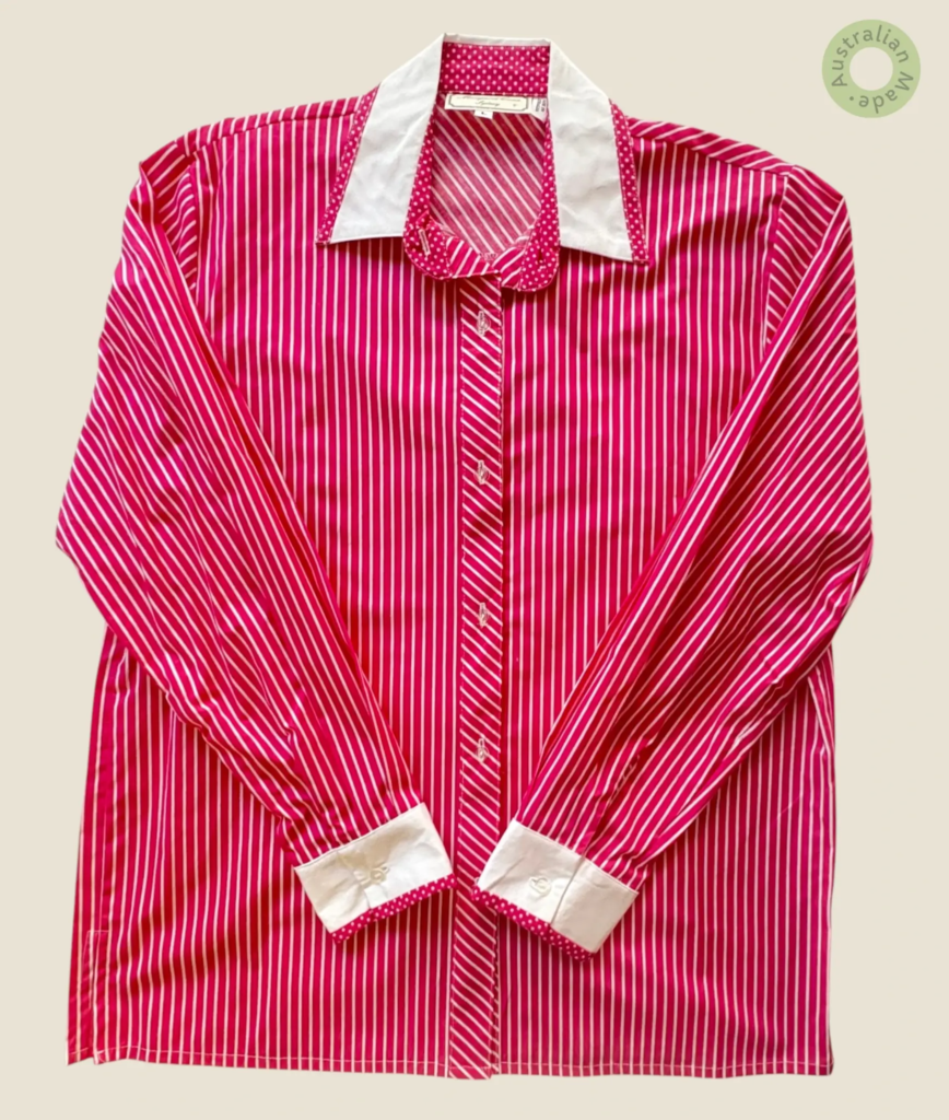 #224 – This shirt is made from a lightweight fabric featuring a vibrant magenta and whi