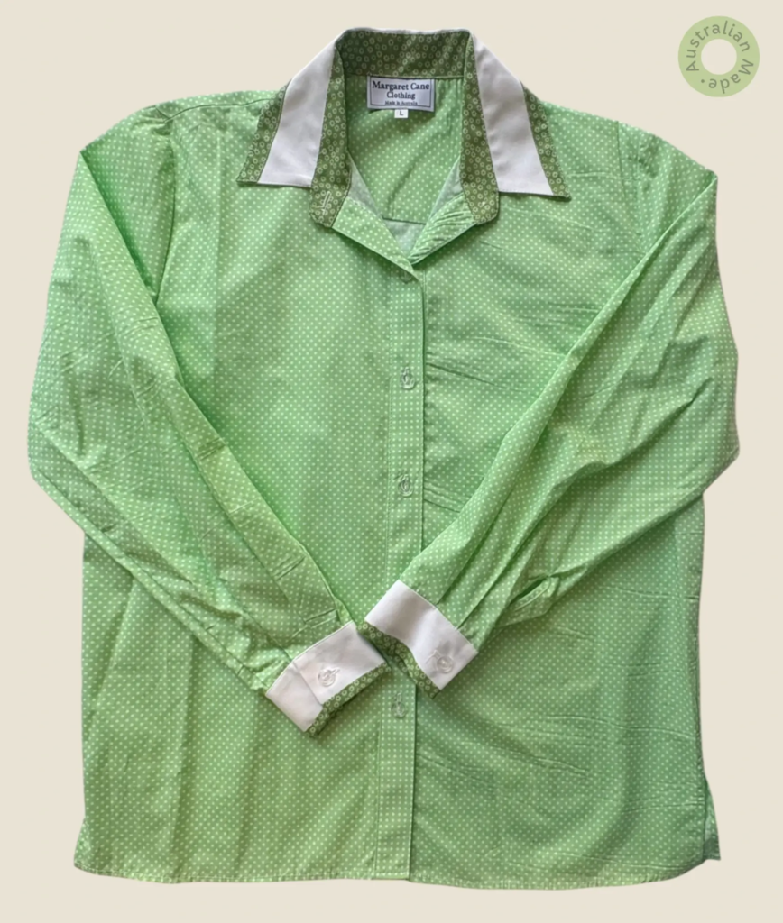 #225 – This shirt is made from a lightweight lime green fabric featuring an all-over wh