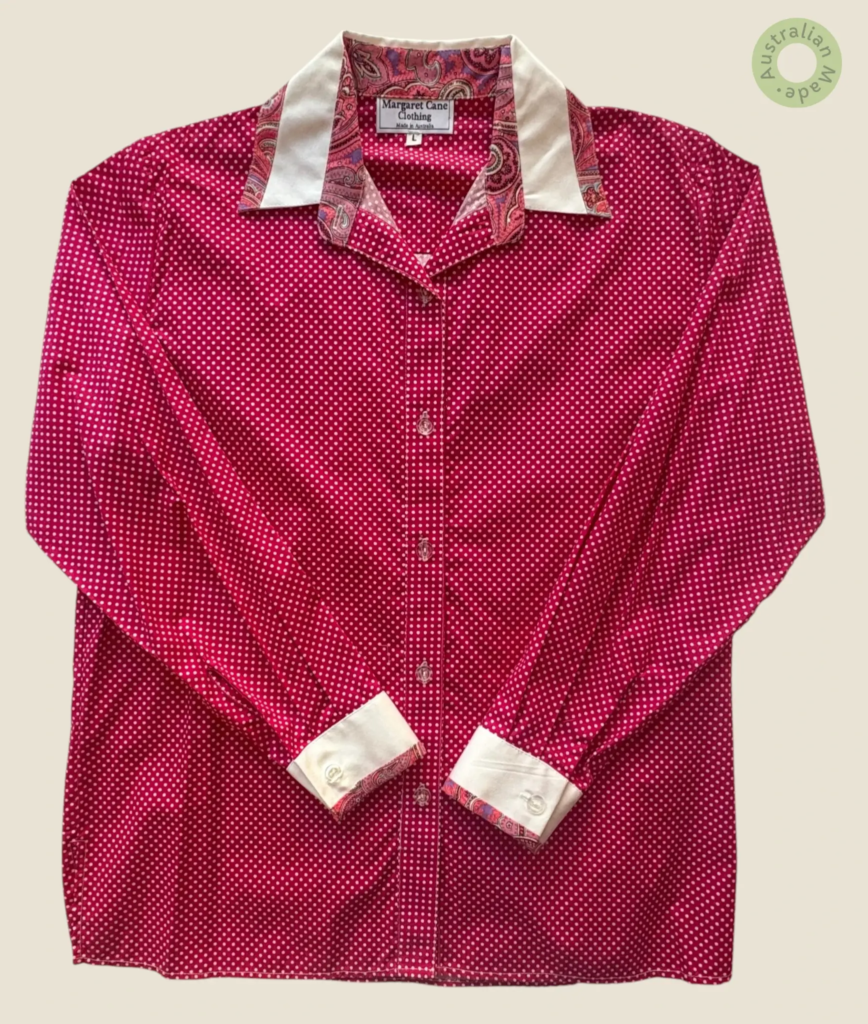 #227 – This professional shirt is made from a lightweight fuchsia fabric featuring an a