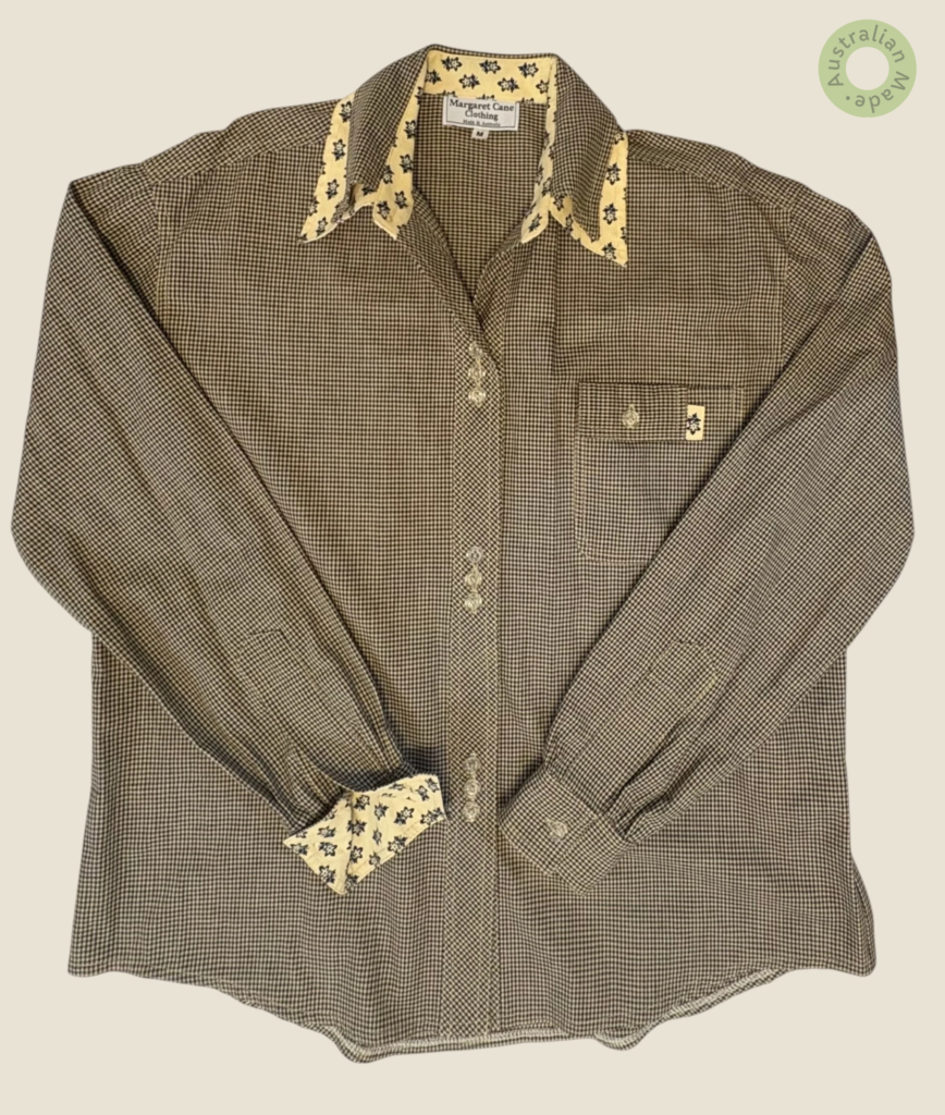 #113 – This shirt features a fine brown and cream micro-check pattern. It is detailed w