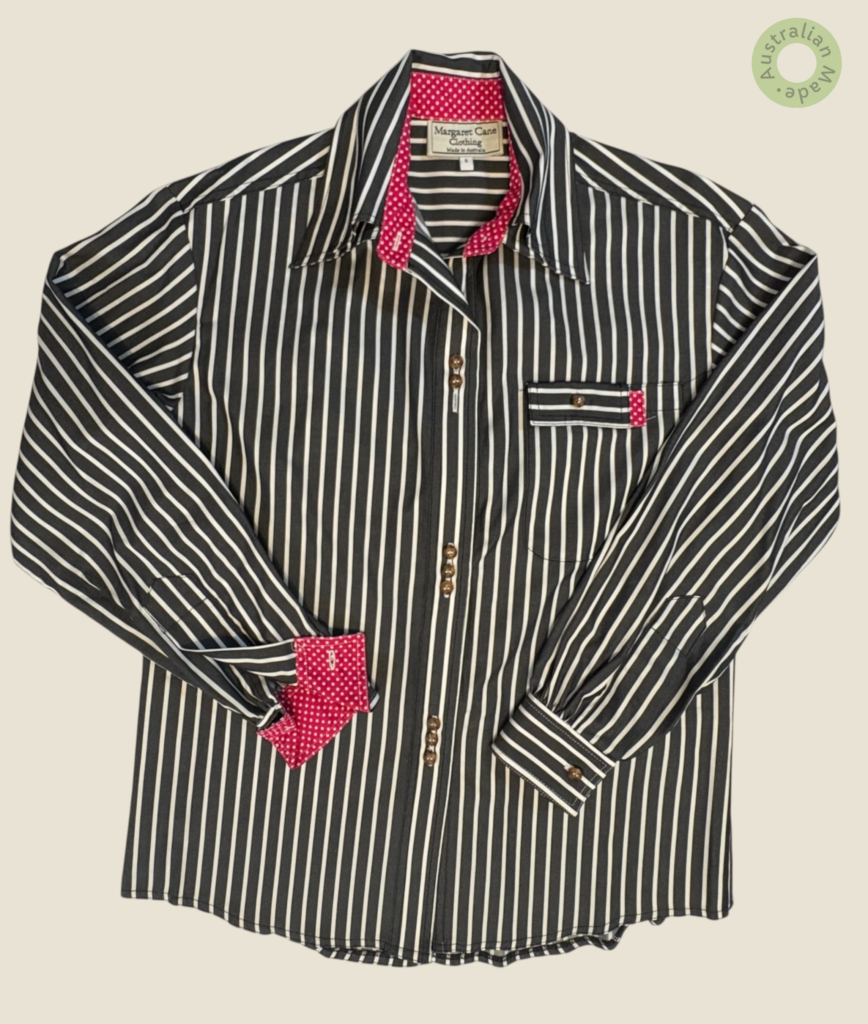 #114 – This professional shirt features a charcoal and white vertical stripe. It is des