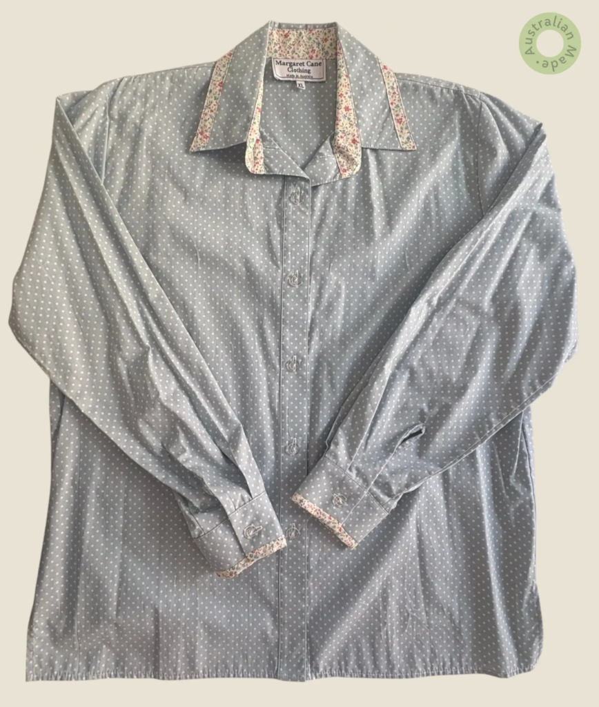 #235 – This shirt is crafted in a pale teal base featuring a white micro-polka dot prin
