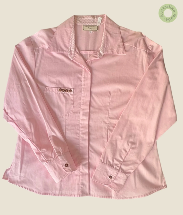 #552 – This classic shirt is crafted from a solid baby pink cotton and features a clean