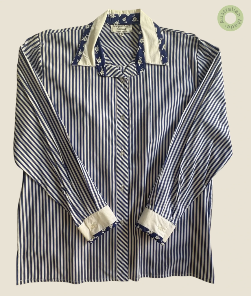 #236 – This shirt features a vibrant cobalt blue and white vertical stripe pattern. It