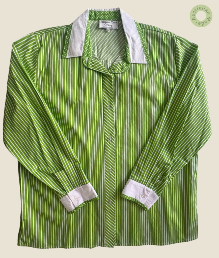 #237 – This shirt features a bright apple green and white vertical stripe pattern, with