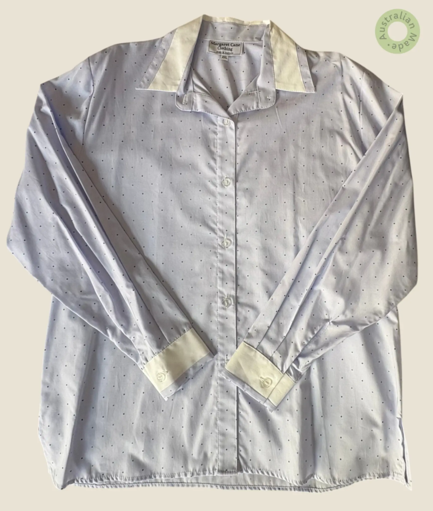 #238 – This shirt is featuring a navy pin-dot print set against a pale lilac base. It i
