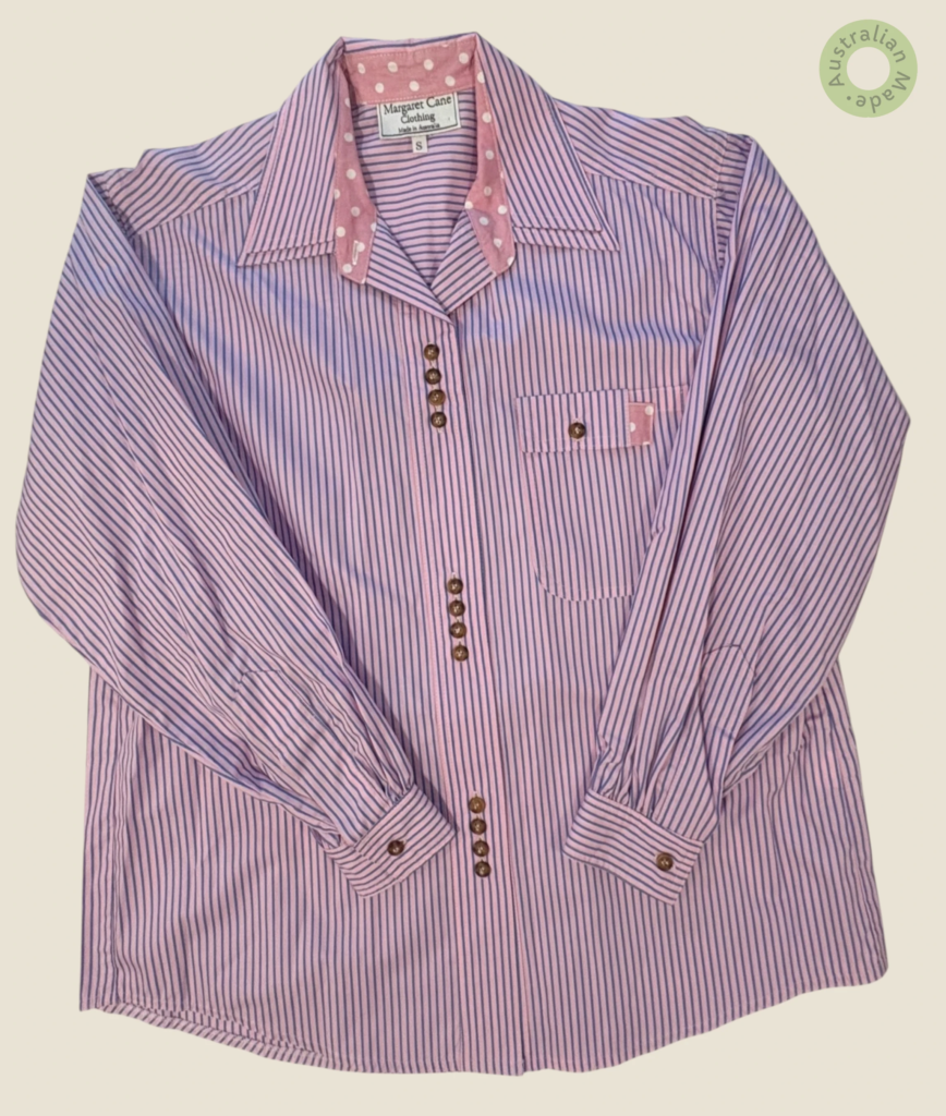 #121 – This professional shirt features a pale pink base with fine navy vertical stripe