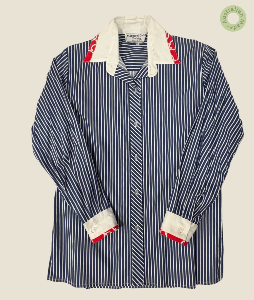 #242 – This shirt features a navy and white vertical stripe pattern on the main body an