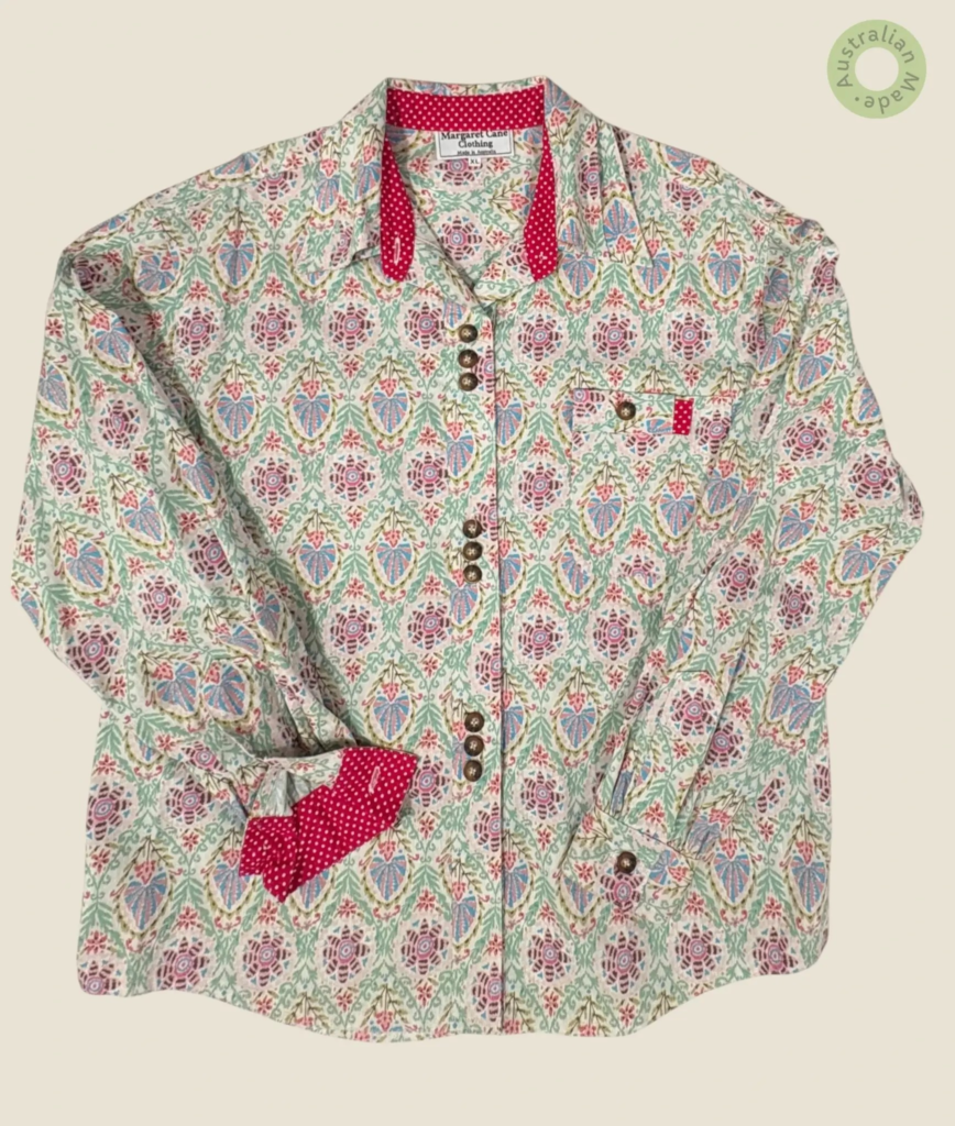 #125 – This professional shirt features an intricate, repeating pattern of stylized flo