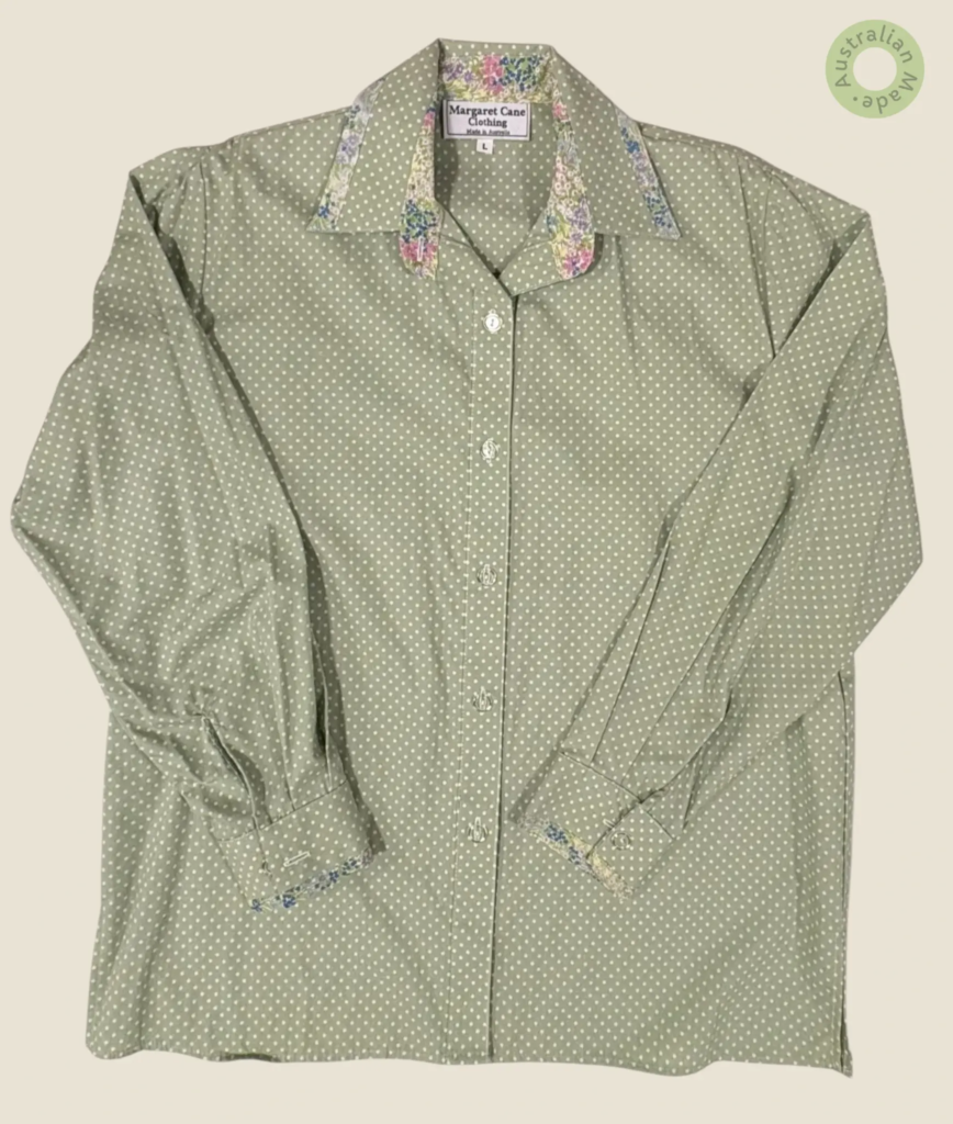 #245 – This shirt features a sage green and white polka dot pattern on the body, sleeve