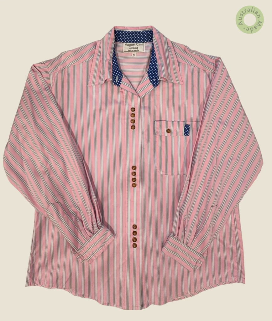 #137 – This shirt features a dense micro-floral print in berry, purple, and green. The