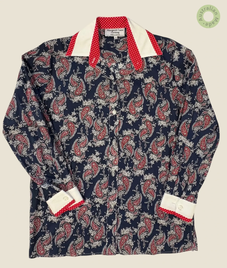 #249 – This shirt features a navy base with a red and white paisley floral pattern thro