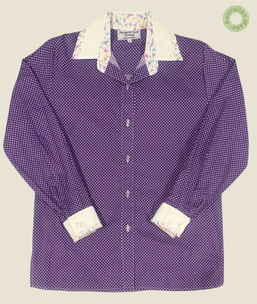 #251 – This shirt features a purple base with a white polka dot pattern throughout the