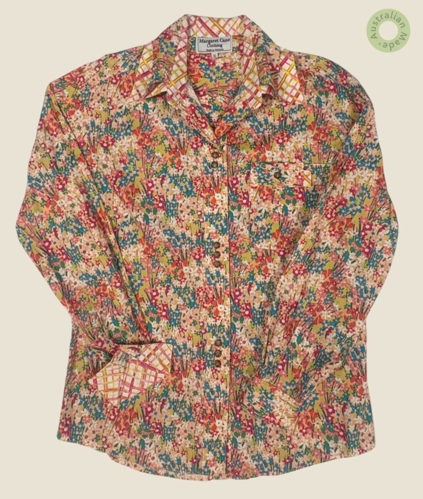 #135 – This shirt features a dense, multicolor wildflower floral pattern throughout the