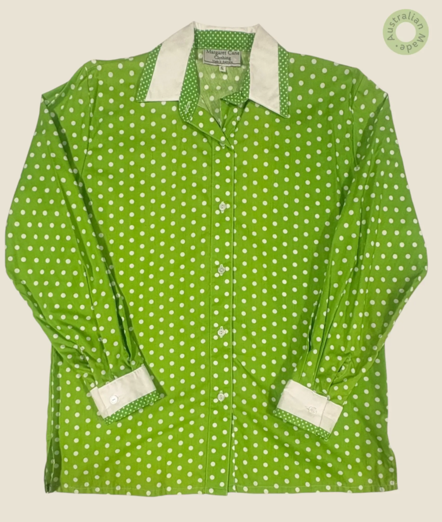#252 – This shirt features a vibrant green base with a white polka dot pattern througho
