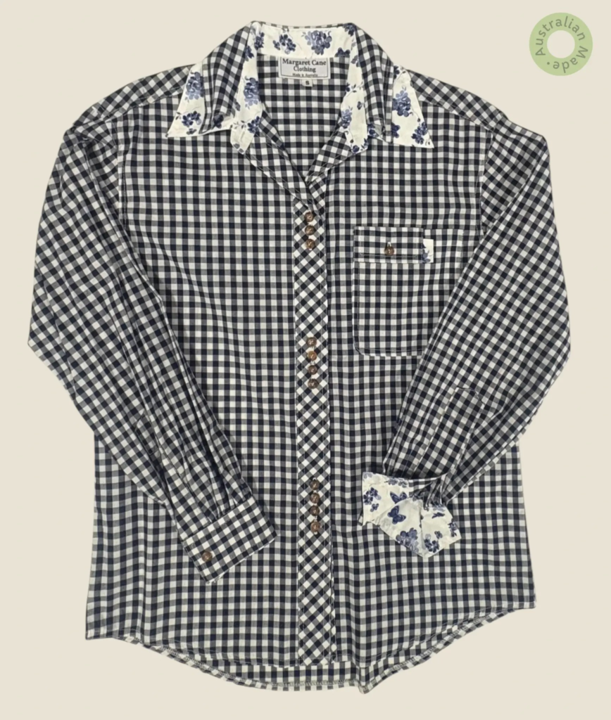 #136 – This shirt features a classic navy and white gingham check pattern throughout th