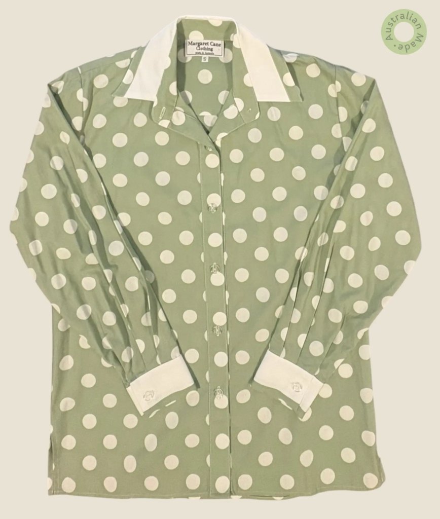 #262 – This shirt features a sage green base with a large white polka dot pattern throu