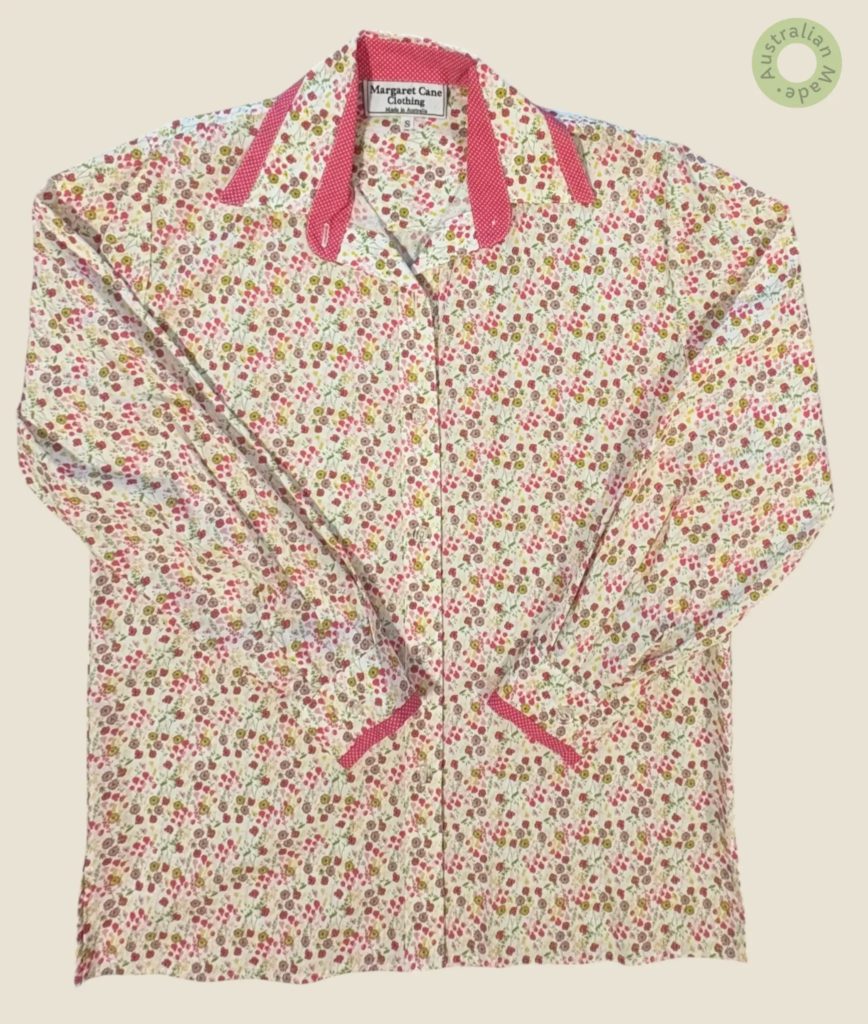 #263 – This shirt features a white base with a dense, multi-colored micro-floral print