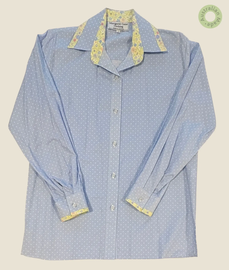 #264 – This shirt features a light blue base with a white micro-polka dot pattern throu