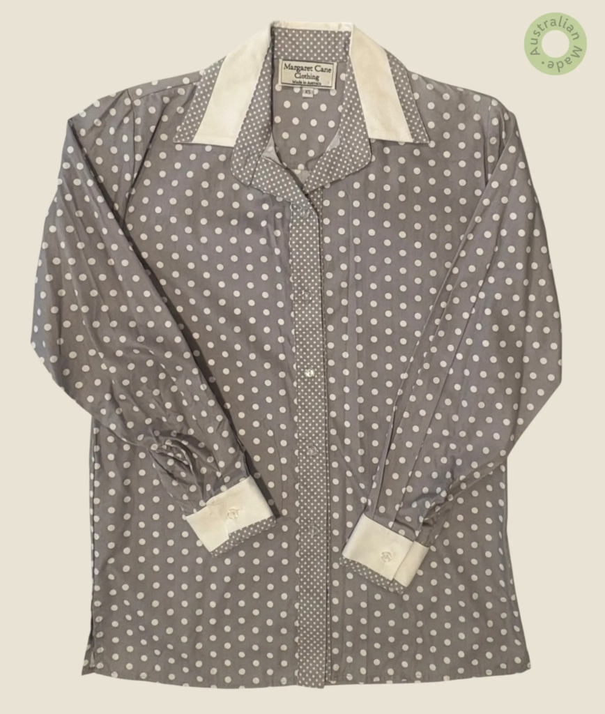 #270 – This shirt features a grey base with a large white polka dot pattern throughout
