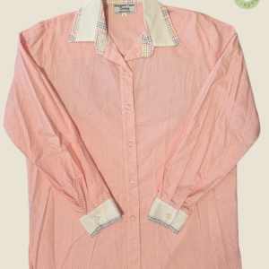 #273 – This shirt features a pink base with small white polka dot pattern throughout th