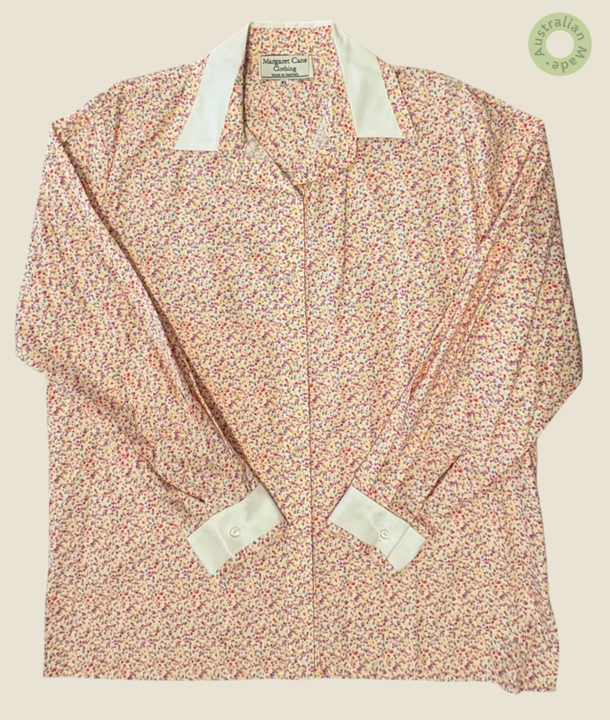 #275 – This shirt features a white base with a dense, multi-colored speckled pattern in