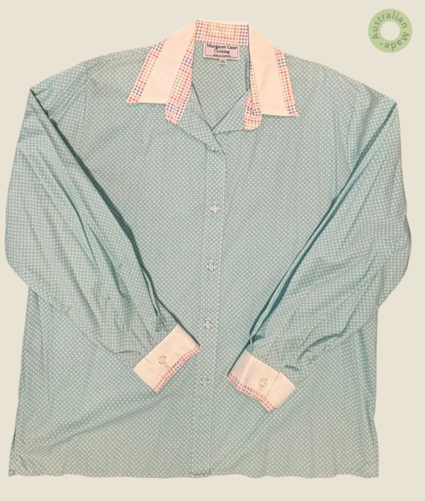 #278 – This shirt features a mint green base with a dense white micro-polka dot pattern