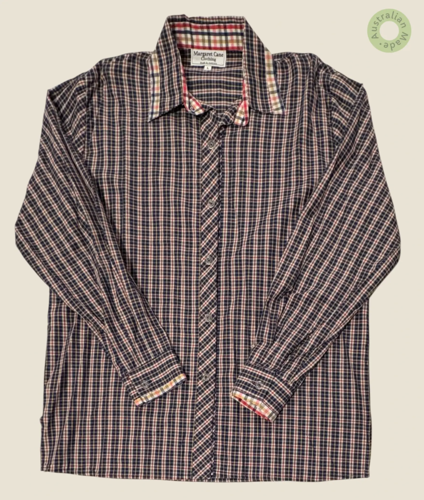 #283 – This shirt features a navy blue base with a fine white and red check pattern thr