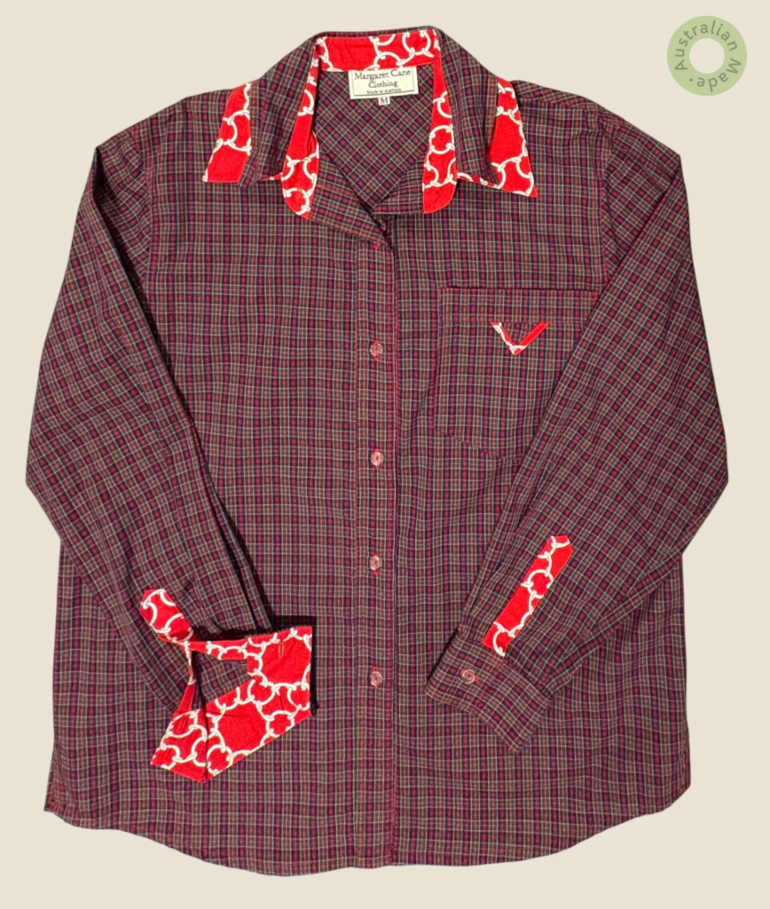 #140 – This shirt features a navy blue base with a fine red and white check pattern thr
