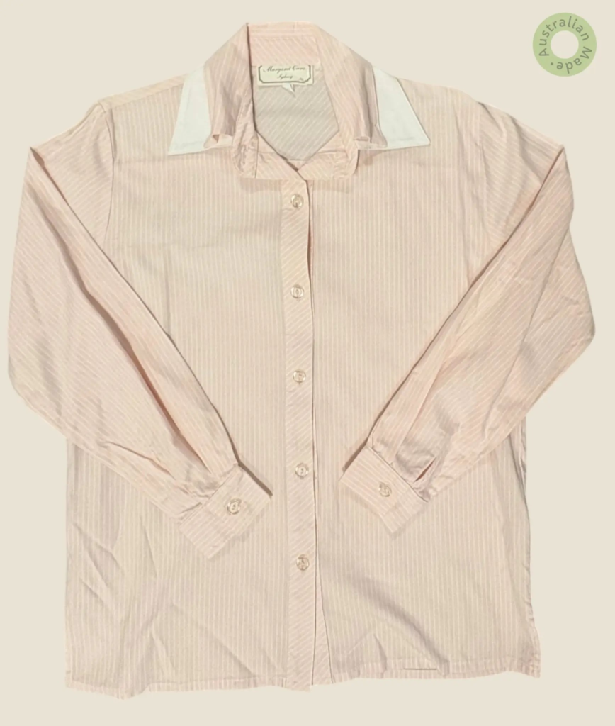 #142 – This shirt features a pale pink base with thin white vertical pinstripes through