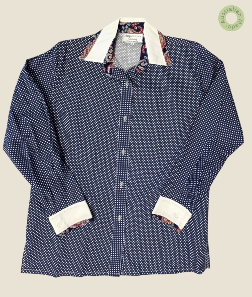 #284 – This shirt features a navy blue base with a dense white micro-polka dot pattern