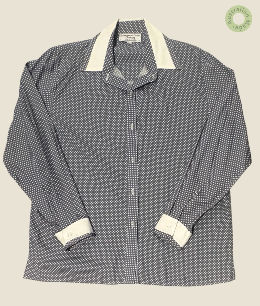 #288 – This shirt features a grey base with a white polka dot pattern throughout, incor