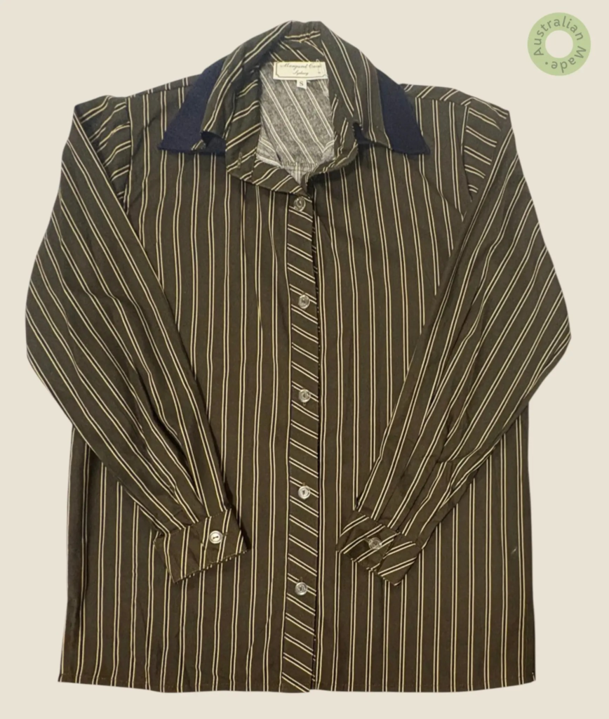 #147 – Dark brown base with gold vertical stripes and a diagonal stripe placket. Featur