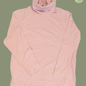 #604 – This top features a light pink base with a white polka dot pattern throughout th