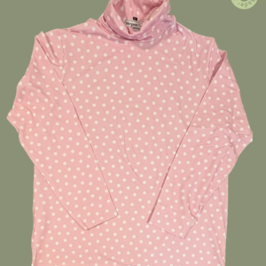 #610 – This top features a pink base with a large white polka dot pattern throughout th