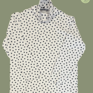 #611 – This top features a white base with a large navy polka dot pattern throughout th